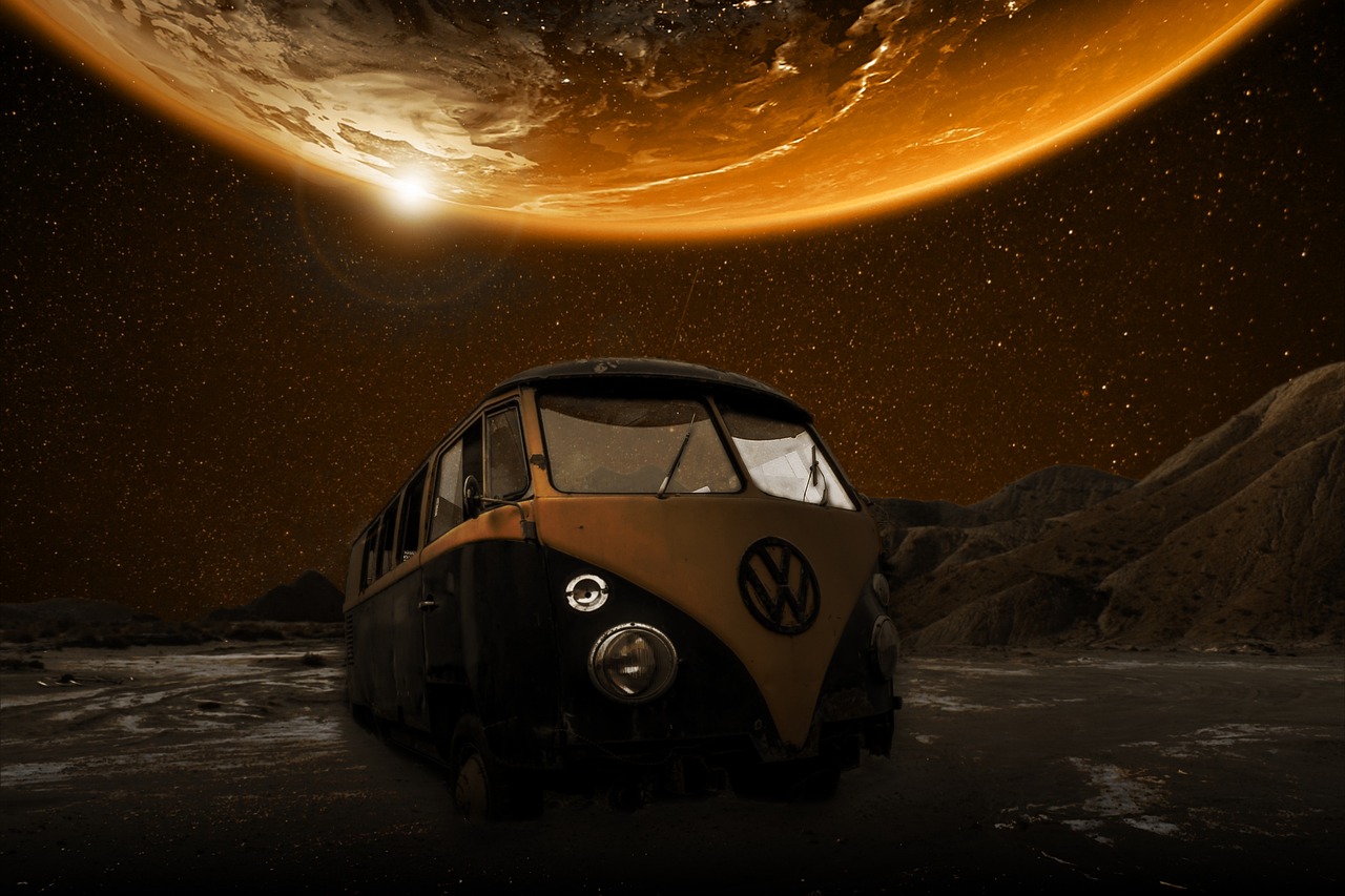 Digital art of a VW van in an alien langscape at night, with rocky terrain and a large, dark orange moon hovering above it, taking up most of the sky.
(image bSteelCityzen on Pixabay) 