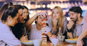 Detail from the Fandom Bazaar poster showing the event title in yellow text with a red "shadow" on a curved green banner.