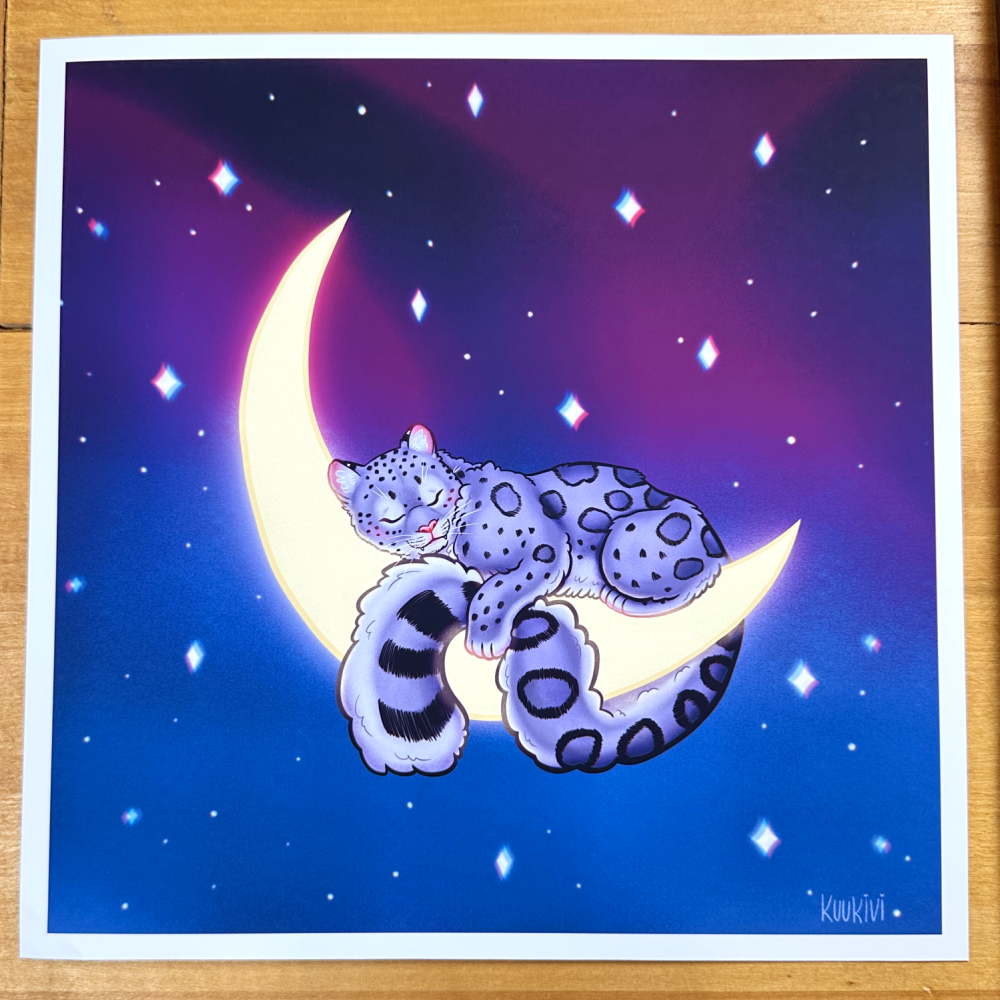 Art print of a sleeping snow leopard curled around a glowing crescent moon against a purple and blue starry sky.